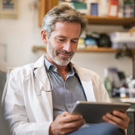 Doctor reviewing patient journey data on a tablet
