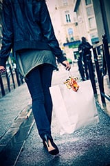 Woman carrying bag on street